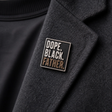 Dope Black Father pin on a denim jacket, a proud Black fatherhood accessory for jackets, bags, and lanyards.